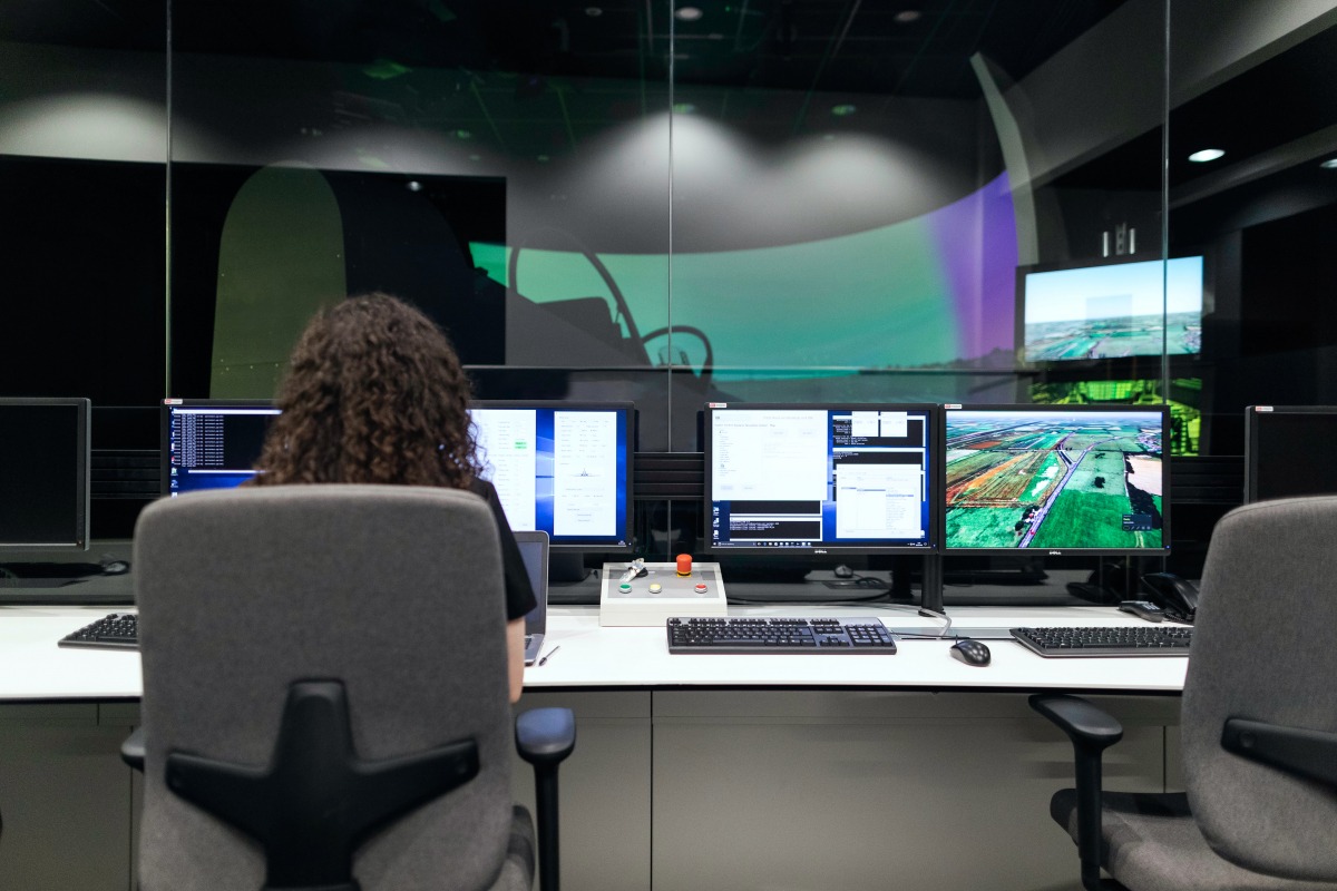 Engineers working on simulation screens